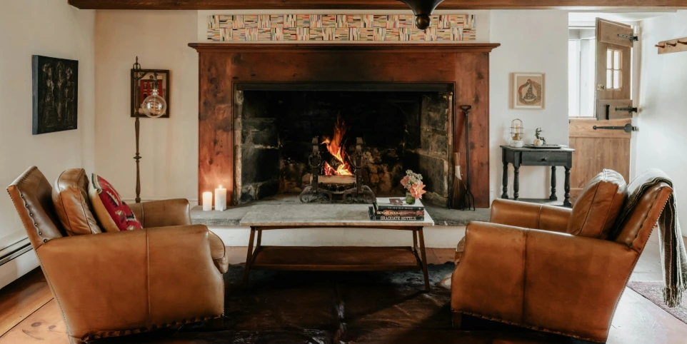 A living room filled with furniture and a fire place